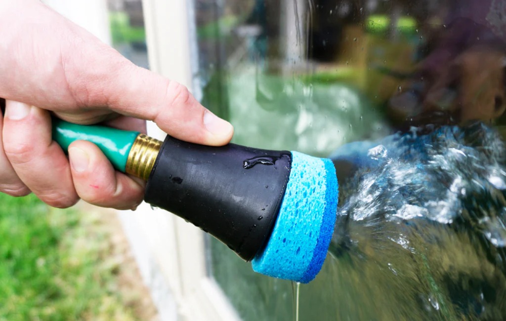 cleaning window with the scrubbie cleaning attachment