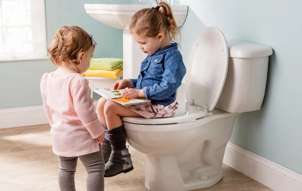 a girl using supper potty trainer