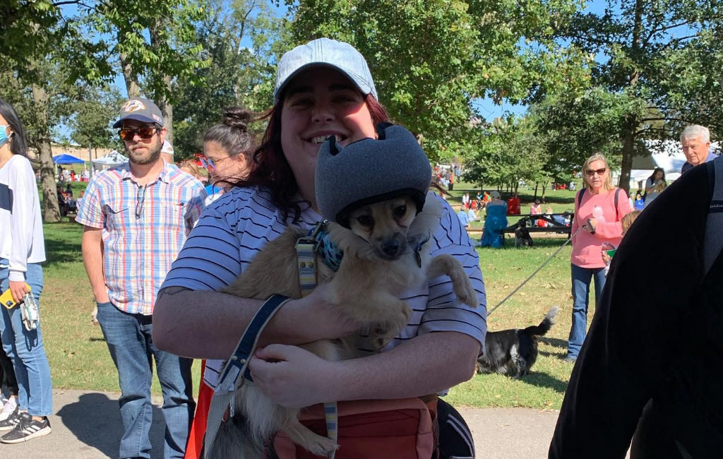 woman holding dog