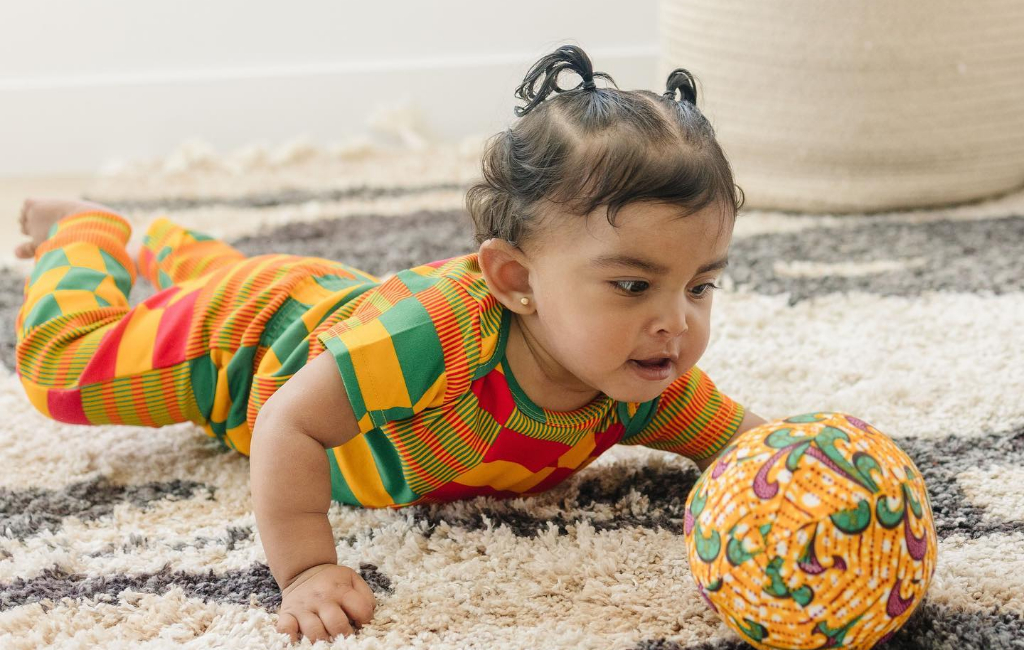 baby playing with ball