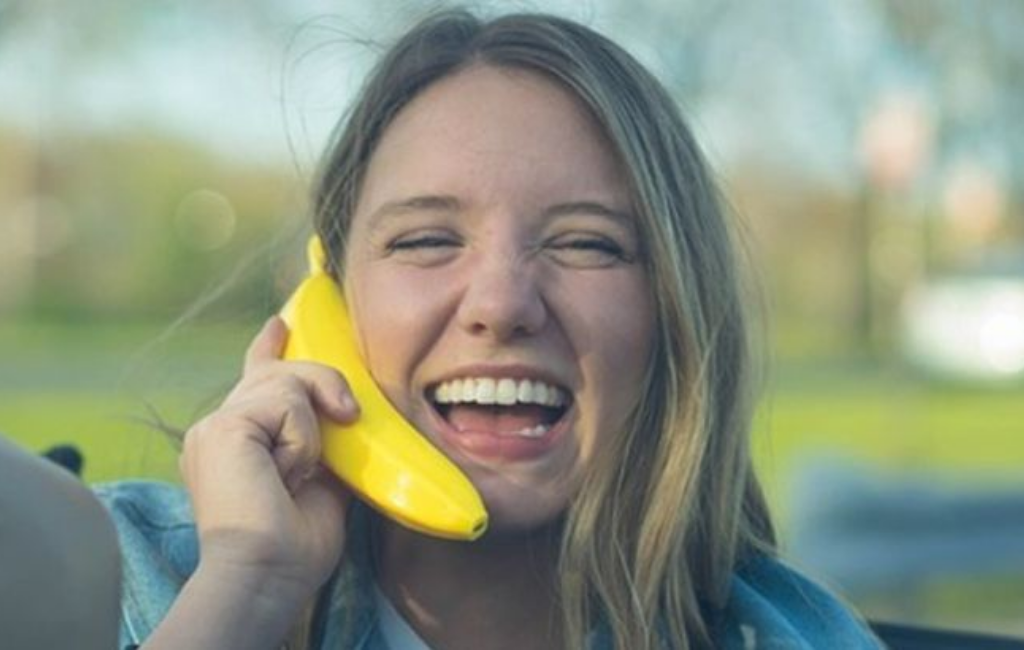 a girl using banana phone