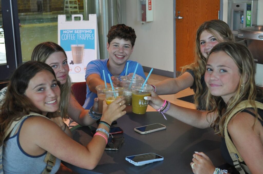 teenagers drinking shake from bleni blends smoothie vending machine