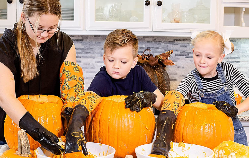 children using halloween moments pumpkin scraper gloves