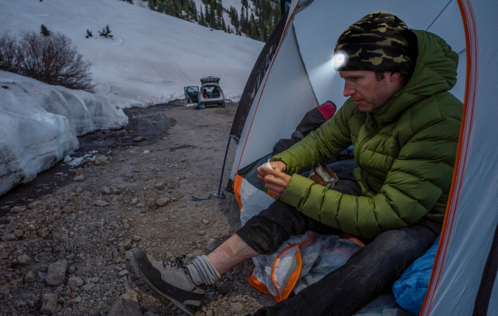 men in front tent