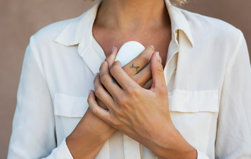 a woman holding parting stone solidified remains