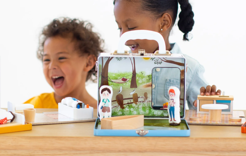 girls playing with play maysie portable dollhouse