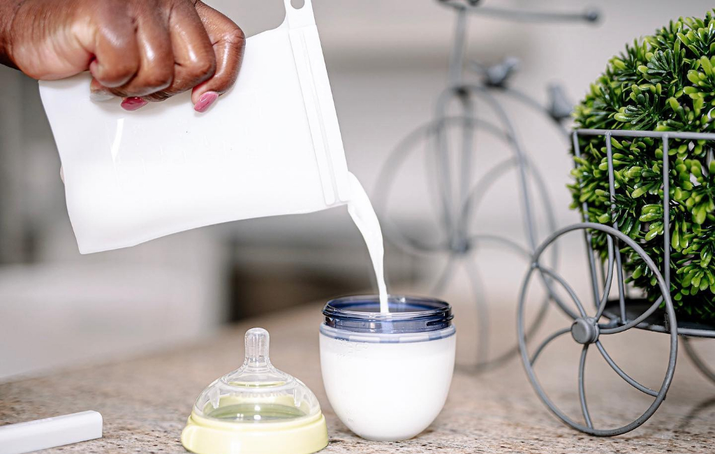 pouring milk in bottle