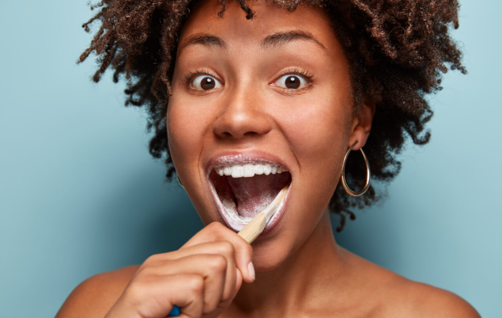 woman-brushing-teeth-using-bite-toothpaste