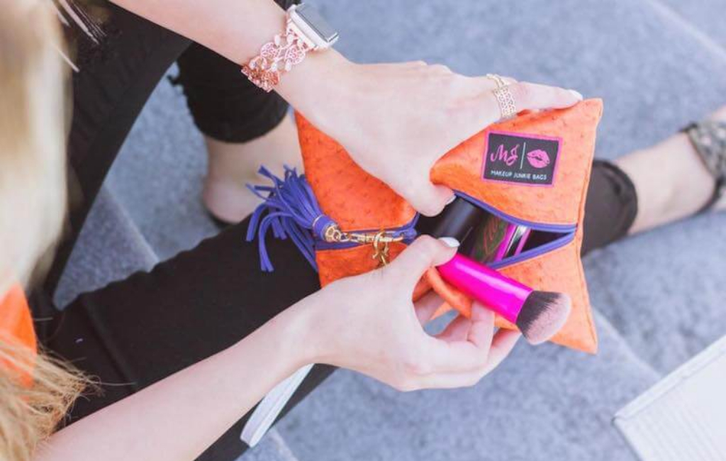 woman using makeup bag