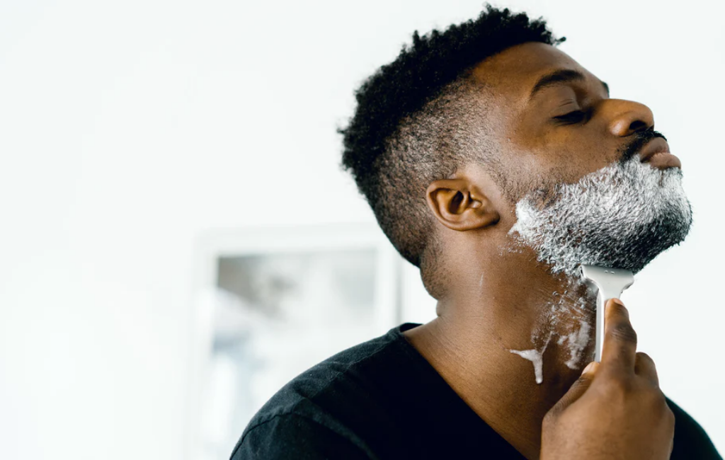 a man shaving with supply razor