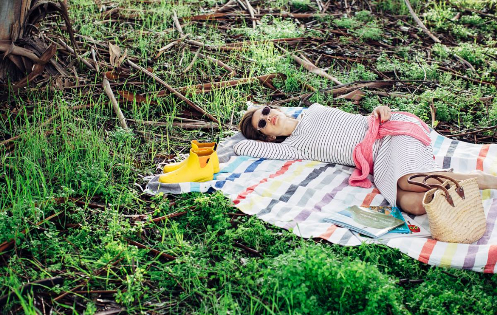 woman lying on blanket