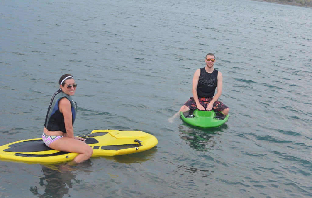 couple sitting on boards