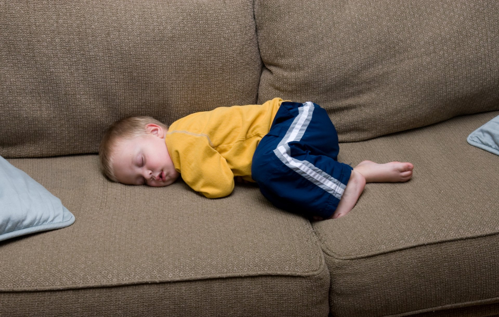 baby sleeping on couch