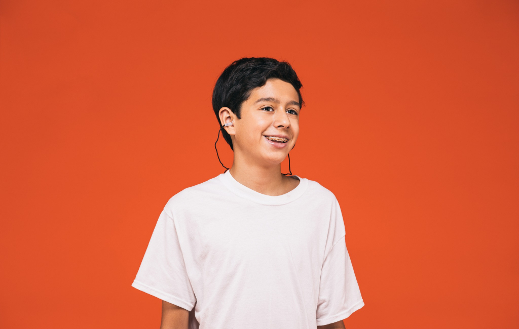 kid with earplugs