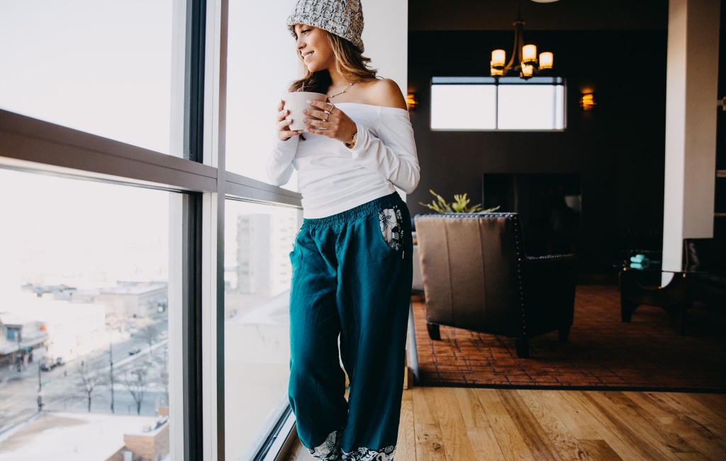 woman looking through window