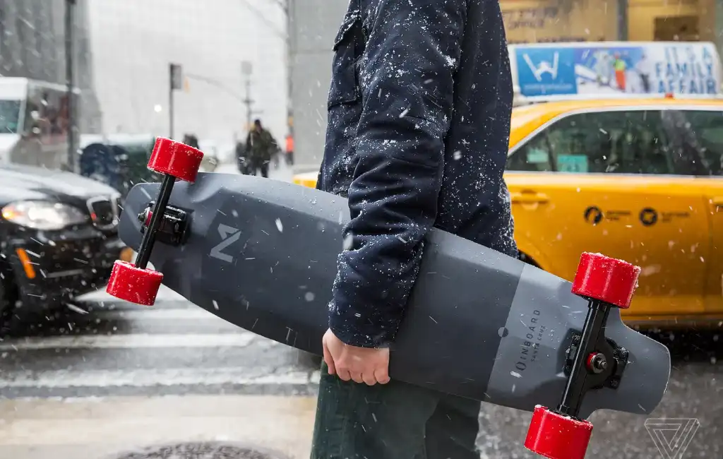 man holding skateboard