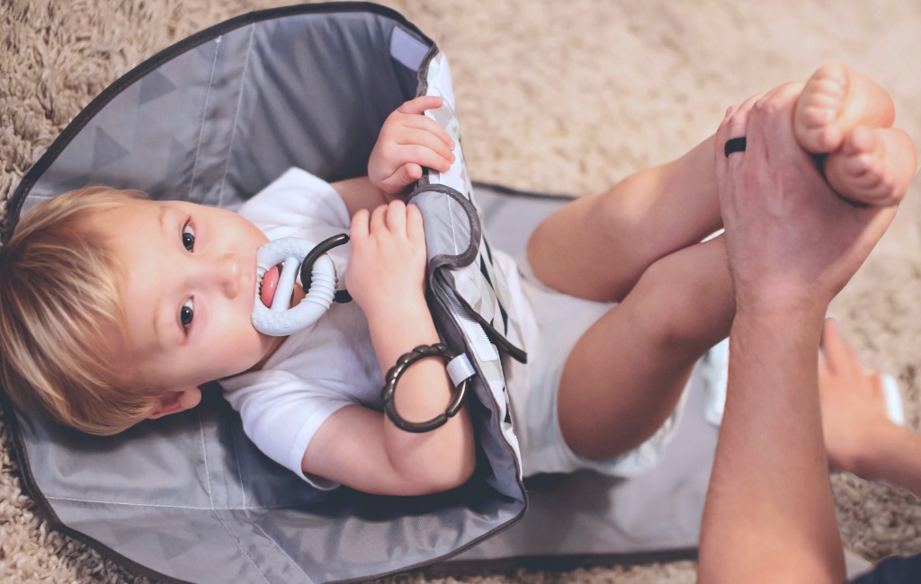 baby-with-snoofybee-diaper-changing-pad