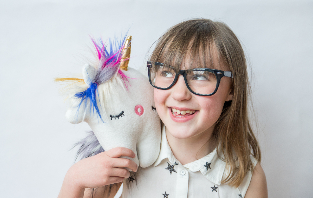 girl with unicorn toy