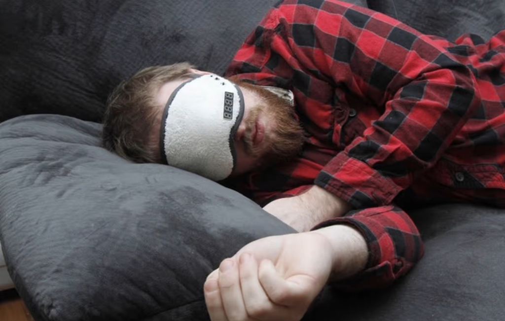 man sleeping with mask