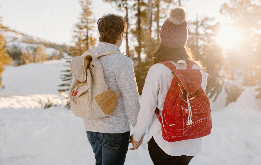 couple hiking through forest