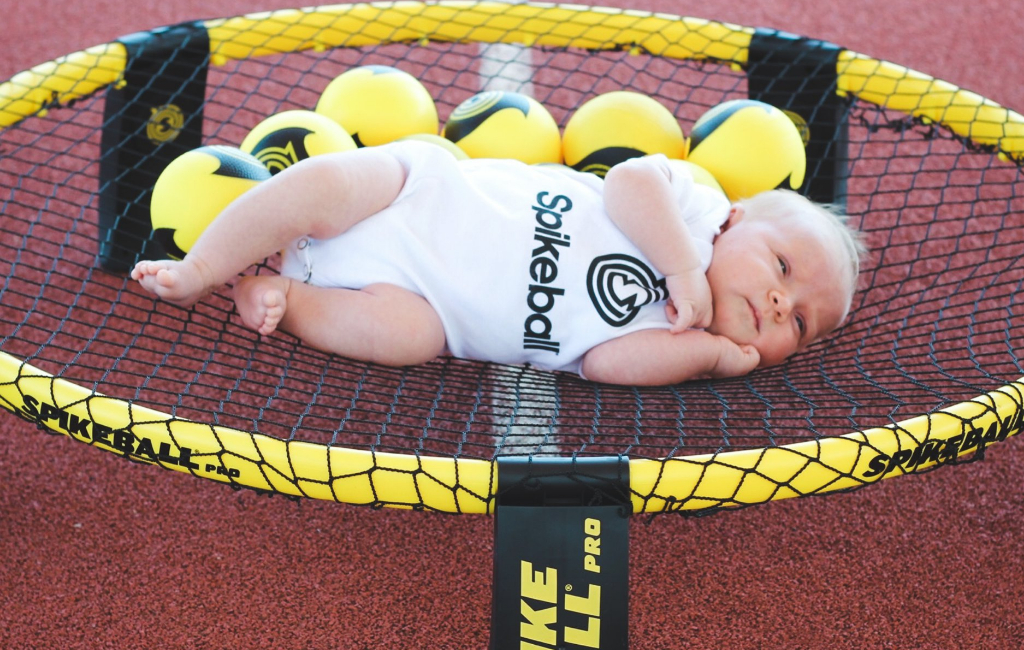 baby in spikeball net