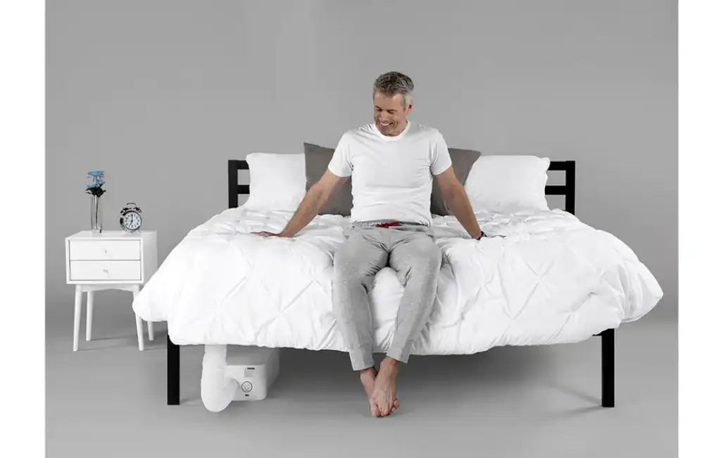 man-sitting-on-bed