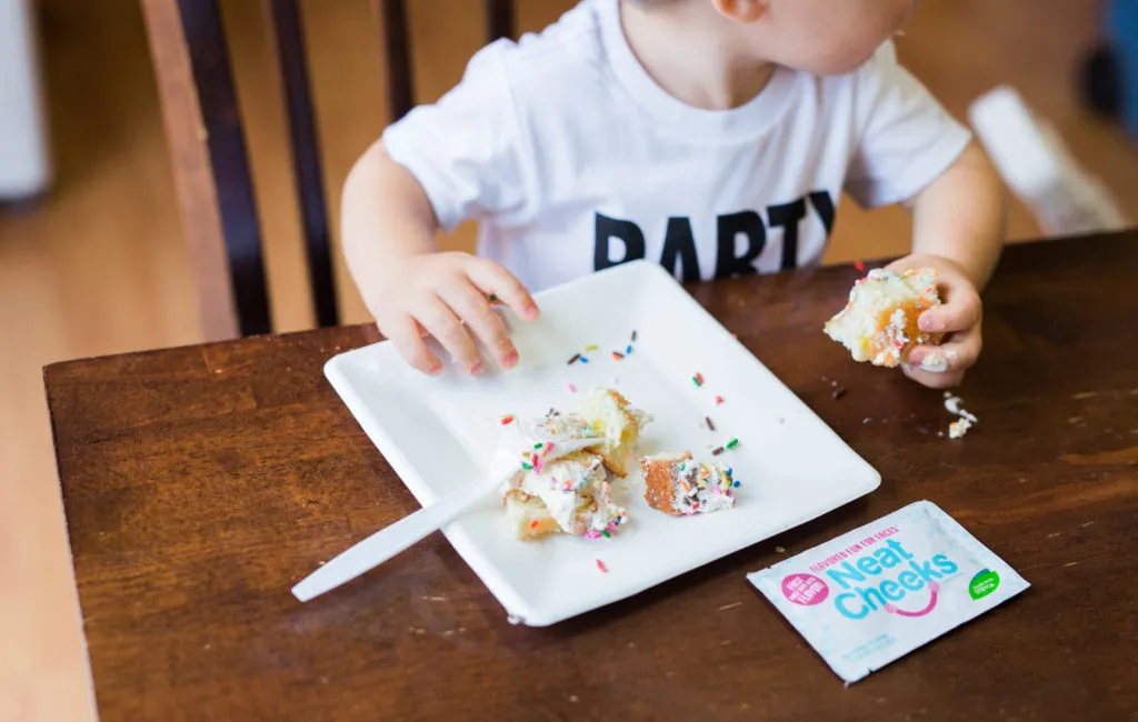 baby eating a cake