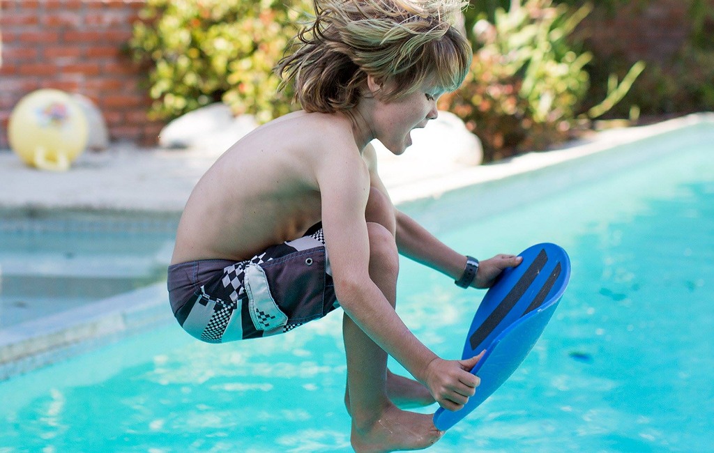 a-boy-playing-with-spooner-balance-board