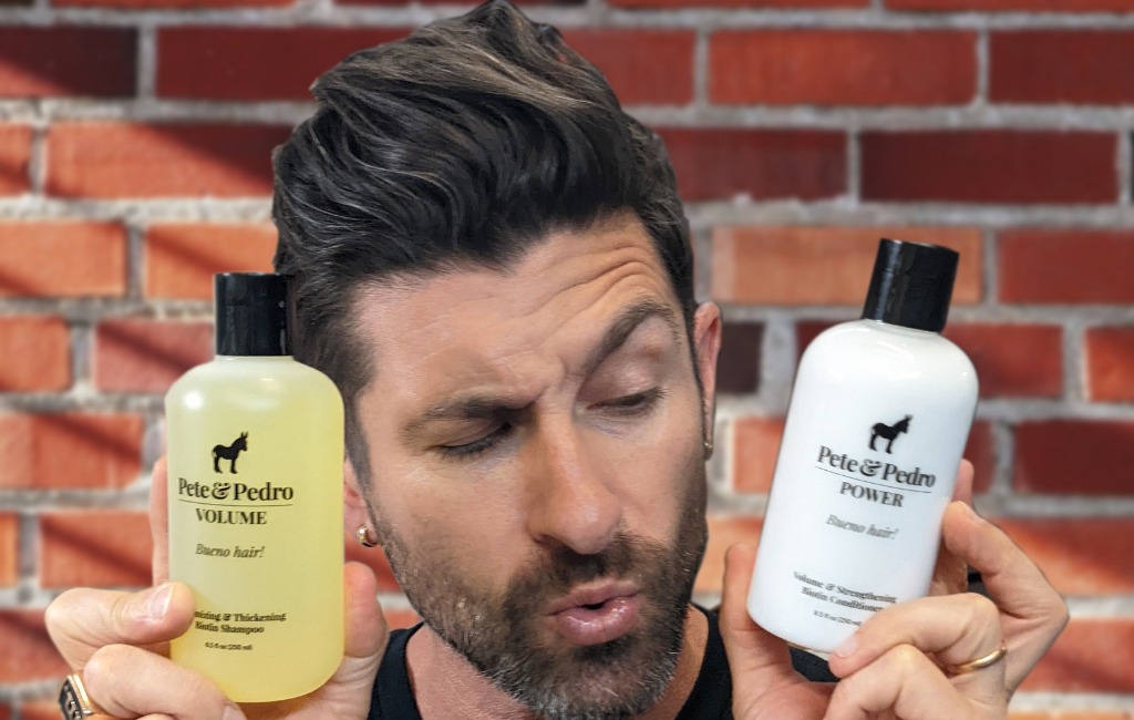 man-holding-pete-&-pedro-men’s-hair-styling-products