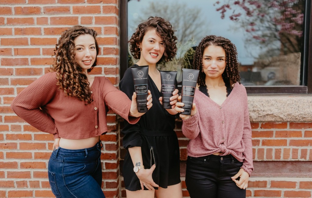 women-using-controlled-chaos-hair-products