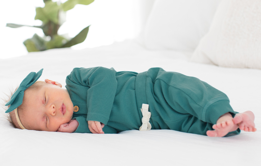 sleeping baby in cool outfit