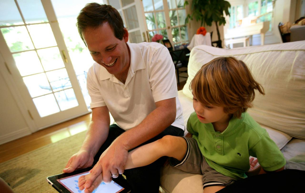 dad-and-son-measuring-foot