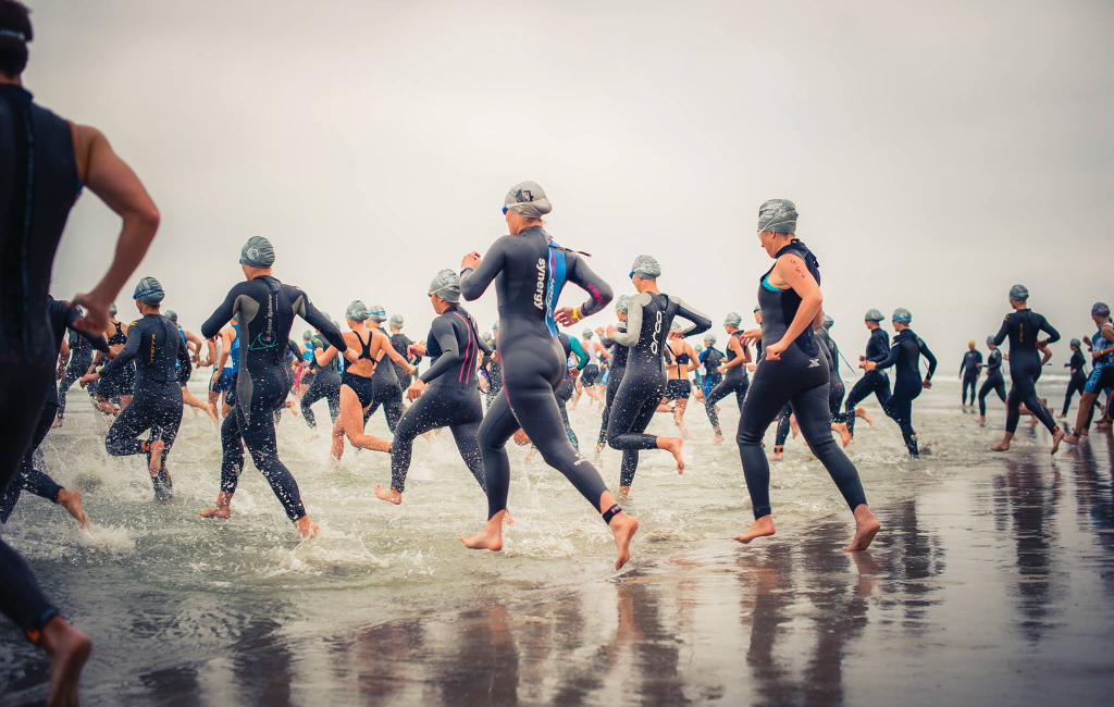 people-running-into-ocean