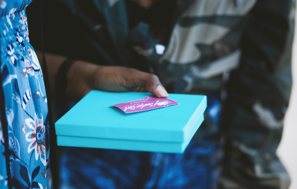 person-holding-gift-box